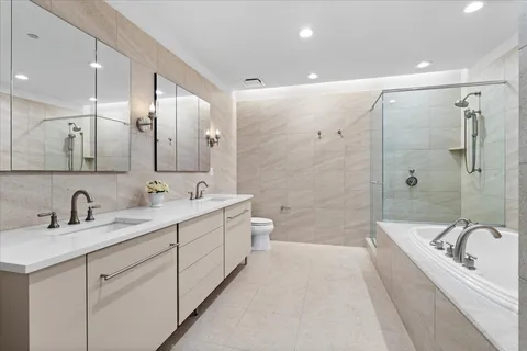 a bathroom with a bathtub and shower