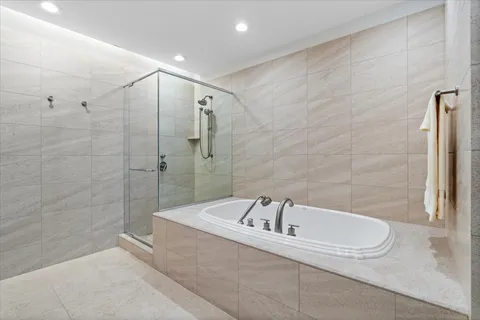 a living room with furniture and large windows