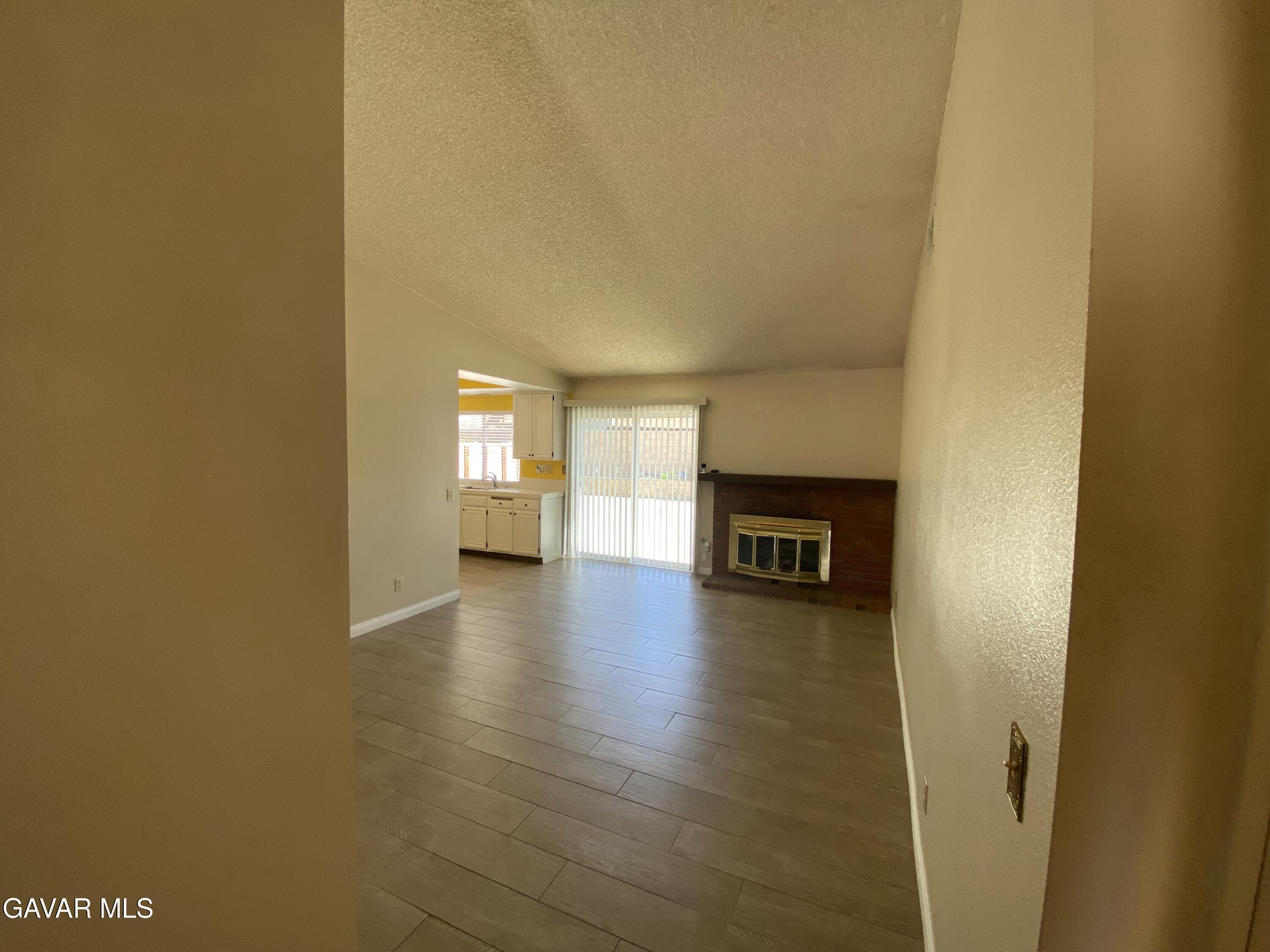 44034 4th Street East Lancaster, CA 93535 - Photo 4 of 14 a view of empty room with wooden floor and window