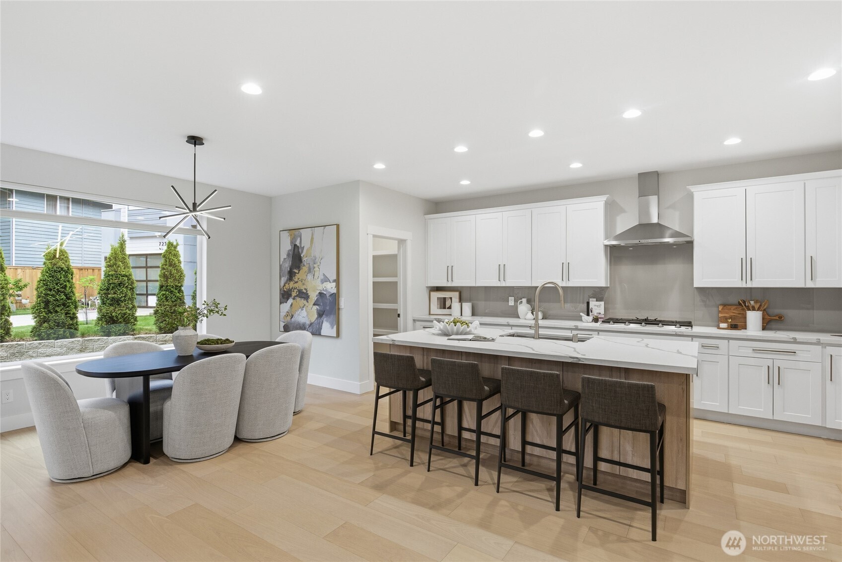 719 Edmonds Way Edmonds, WA 98020 - Photo 11 of 40 a large kitchen with kitchen island a island a stove a cabinets a sink and a island