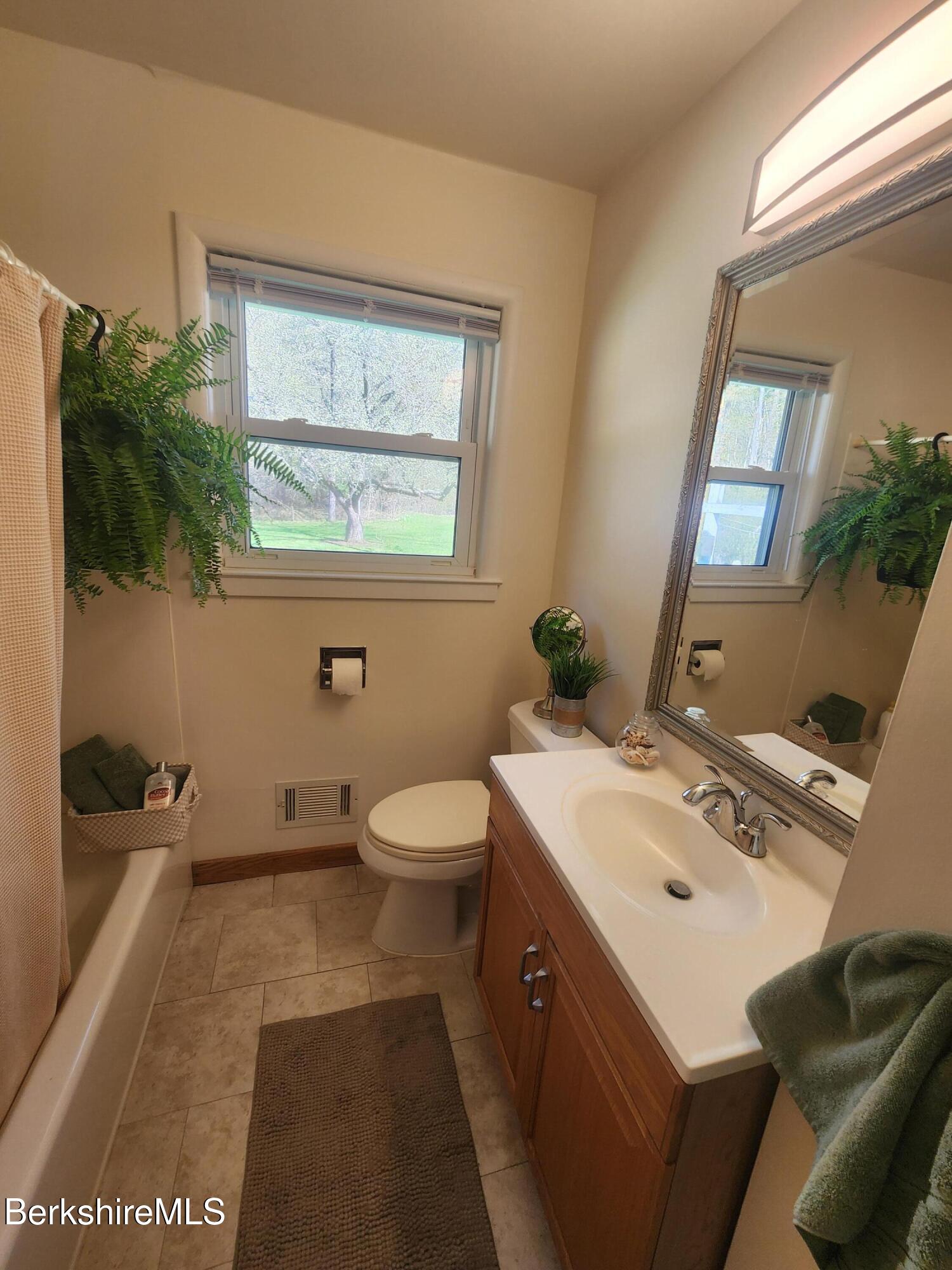 16 East New Lenox Road Lenox, MA 01240 - Photo 23 of 31 a bathroom with a sink toilet and mirror