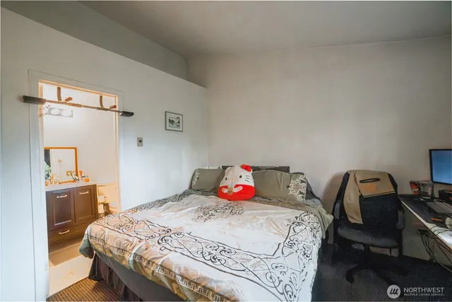 a bedroom with a bed and a dresser