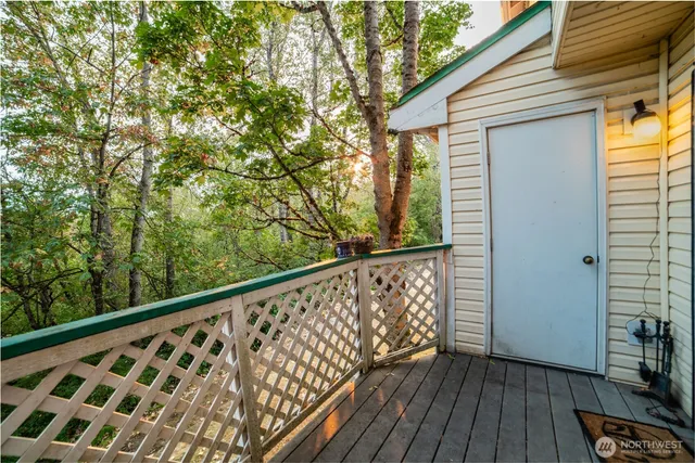 a view of balcony with wooden floor