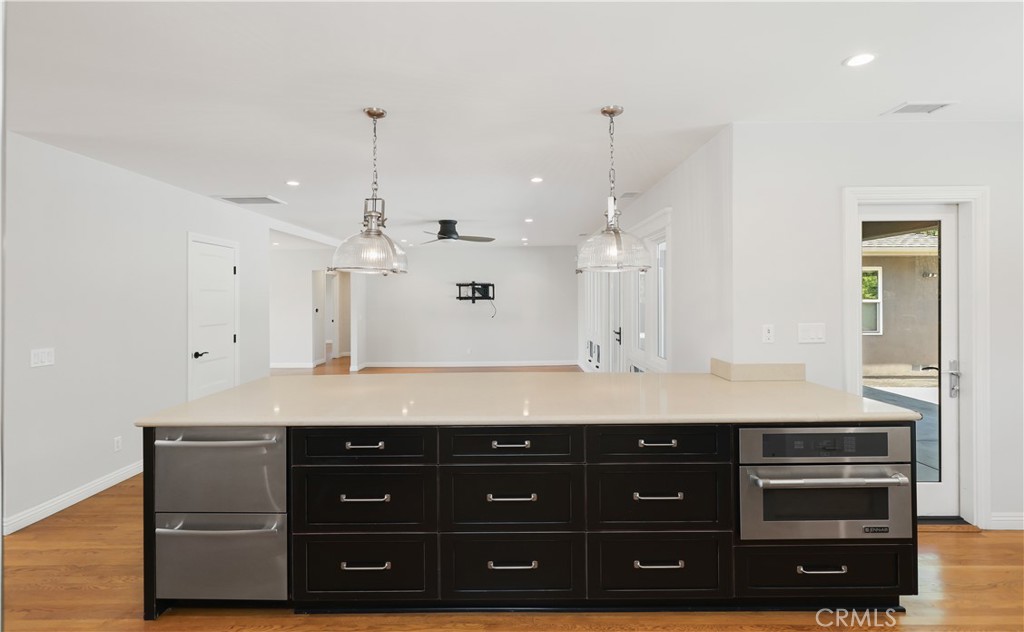 933 West Riviera Drive Santa Ana, CA 92706 - Photo 11 of 43 a bathroom with a sink a vanity and a large mirror