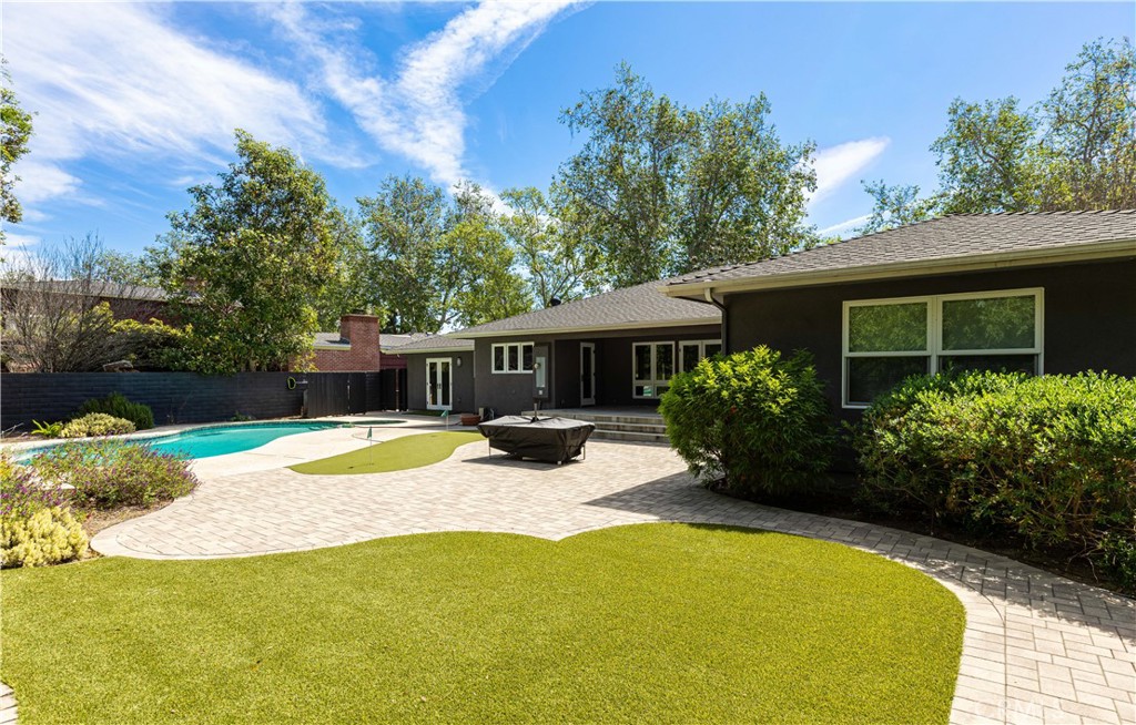 933 West Riviera Drive Santa Ana, CA 92706 - Photo 19 of 43 a view of a house with backyard and sitting area