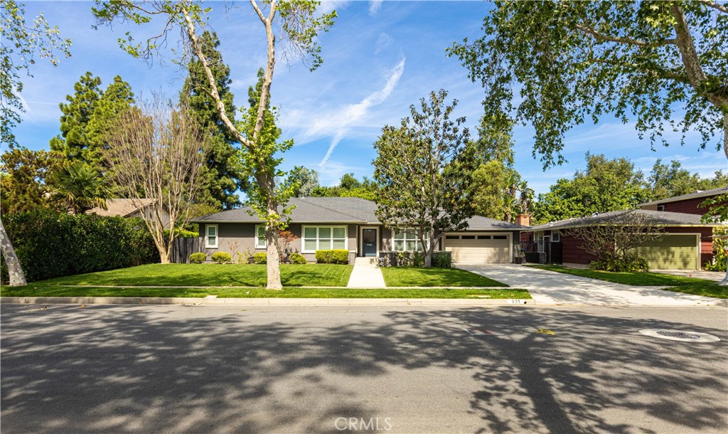 933 West Riviera Drive Santa Ana, CA 92706 - Photo 2 of 43 a front view of house with yard and green space