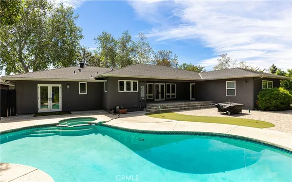 a view of a house with a swimming pool