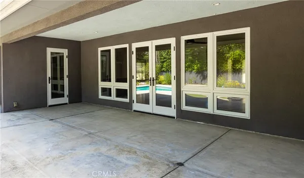 a view of an empty room with a large window