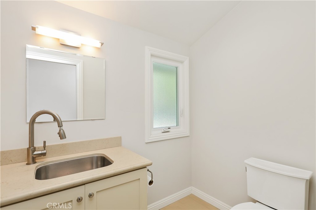 933 West Riviera Drive Santa Ana, CA 92706 - Photo 26 of 43 a bathroom with a sink and a toilet