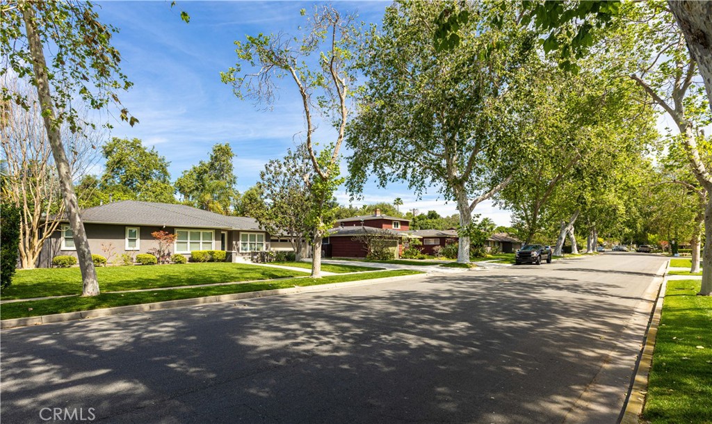 933 West Riviera Drive Santa Ana, CA 92706 - Photo 3 of 43 a front view of a house with a yard and trees