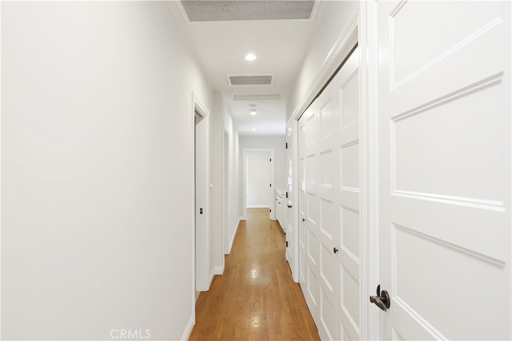 933 West Riviera Drive Santa Ana, CA 92706 - Photo 34 of 43 a view of a hallway with white walls