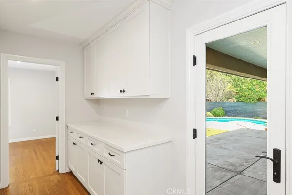 a view of an entryway with wooden floor