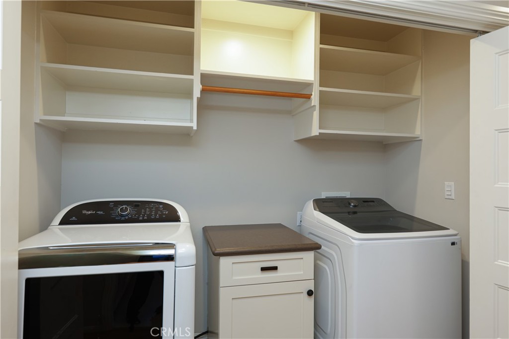 933 West Riviera Drive Santa Ana, CA 92706 - Photo 43 of 43 a view of storage and utility room with washer and dryer