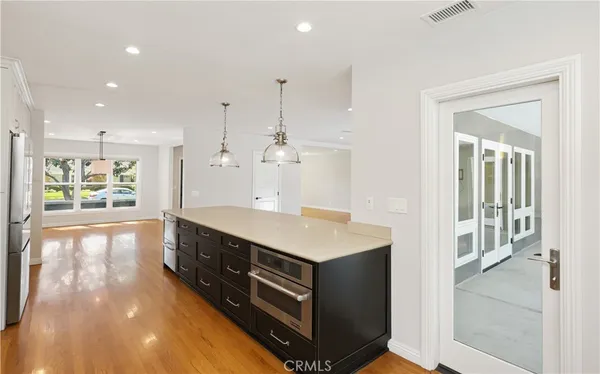 a spacious bathroom with a sink and a large mirror