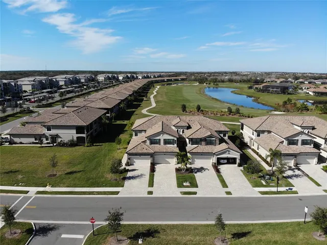 an aerial view of a house with a ocean view