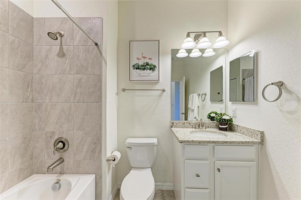 6086 Worsham Lane, Unit 103 Bradenton, FL 34211 - Photo 27 of 60 a bathroom with a sink a toilet and shower