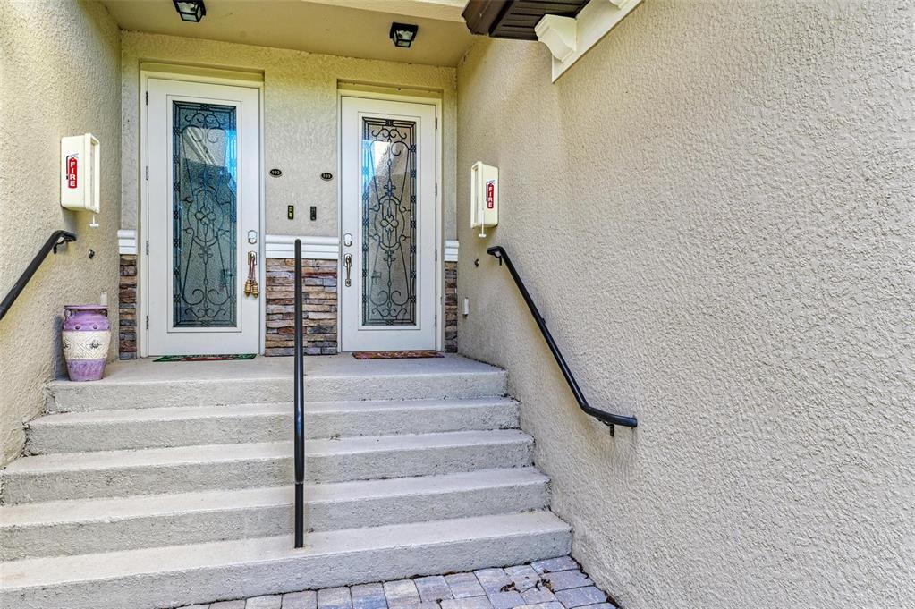 6086 Worsham Lane, Unit 103 Bradenton, FL 34211 - Photo 5 of 60 a view of staircase with white walls and a rug
