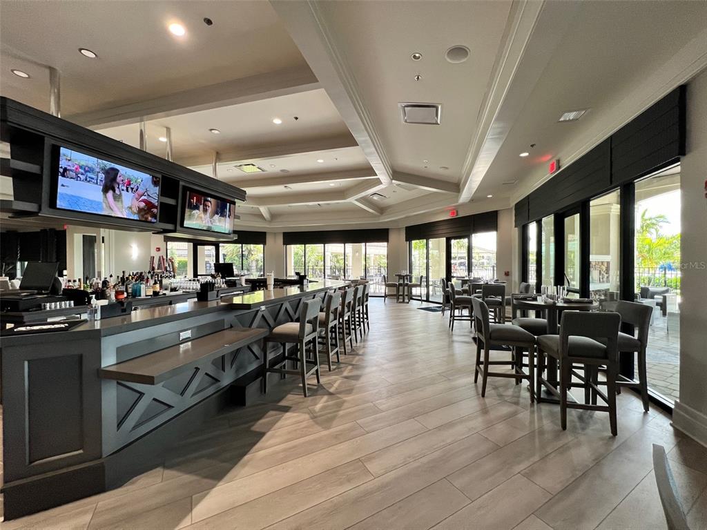 6086 Worsham Lane, Unit 103 Bradenton, FL 34211 - Photo 55 of 60 a view of a dining area with furniture window and wooden floor