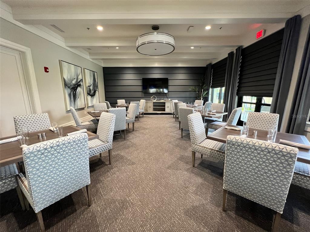 6086 Worsham Lane, Unit 103 Bradenton, FL 34211 - Photo 57 of 60 a living room with furniture and a large window