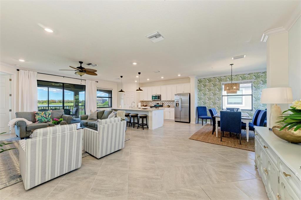 6086 Worsham Lane, Unit 103 Bradenton, FL 34211 - Photo 7 of 60 a living room with furniture and a large window