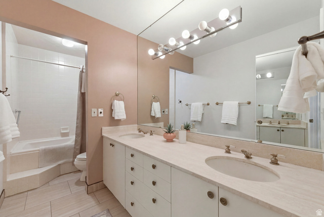 3674 Oak Rim Way Salt Lake City, UT 84109 - Photo 18 of 47 Double vanity with integrated sinks and brass-toned fixtures