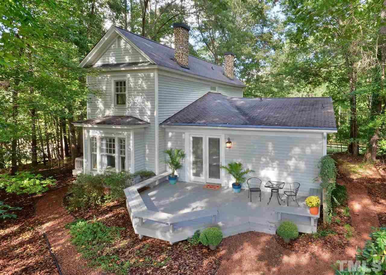 2114 Bahama Road Bahama, NC 27503 - Photo 1 of 21 a front view of a house with garden