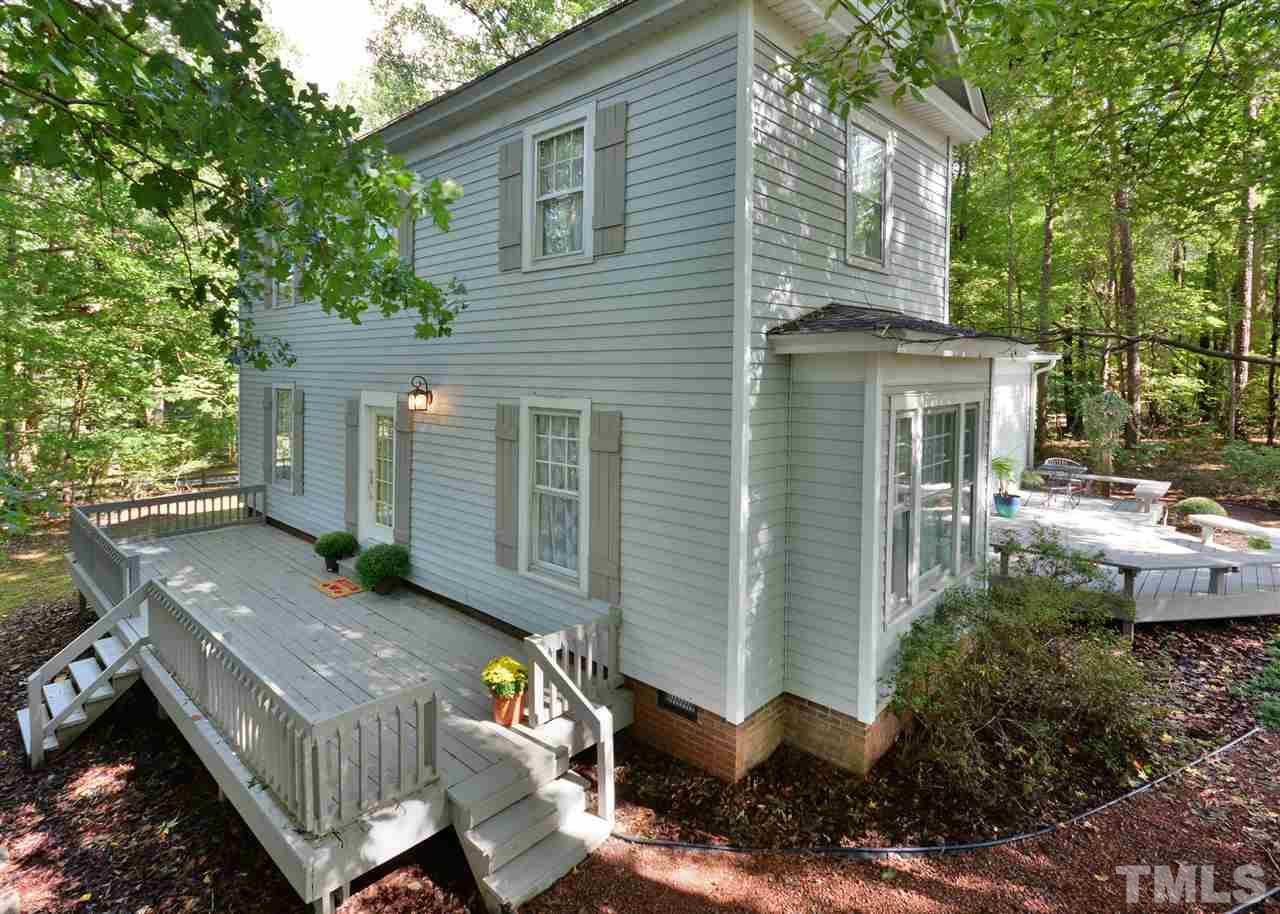 2114 Bahama Road Bahama, NC 27503 - Photo 2 of 21 a view of backyard with outdoor seating and plants