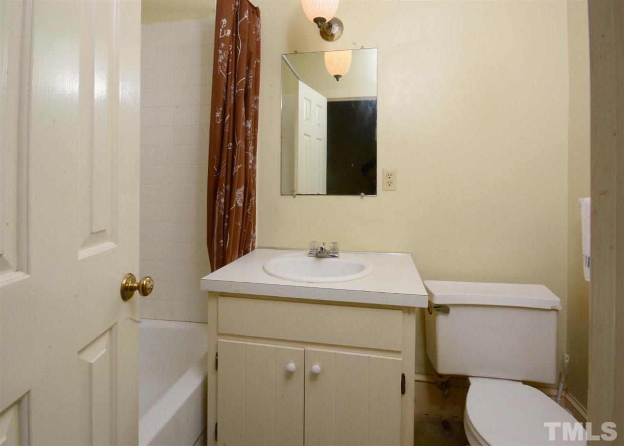 2114 Bahama Road Bahama, NC 27503 - Photo 19 of 21 a bathroom with a sink toilet and mirror