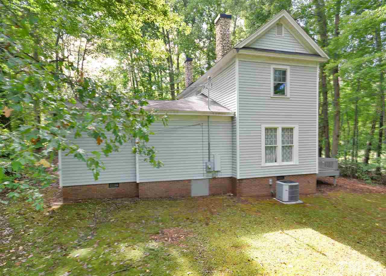 2114 Bahama Road Bahama, NC 27503 - Photo 4 of 21 a front view of a house with garden