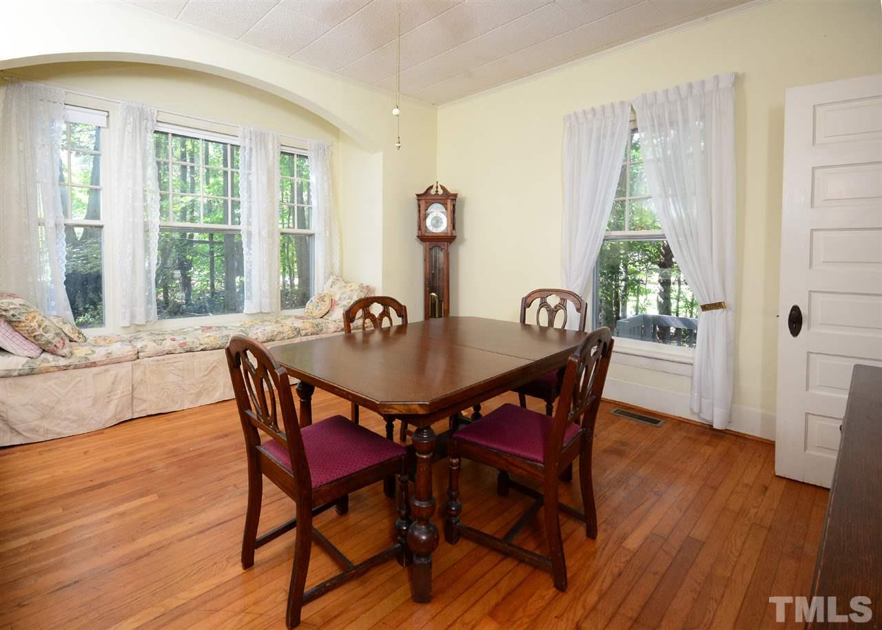 2114 Bahama Road Bahama, NC 27503 - Photo 5 of 21 a view of a dining room with furniture and wooden floor