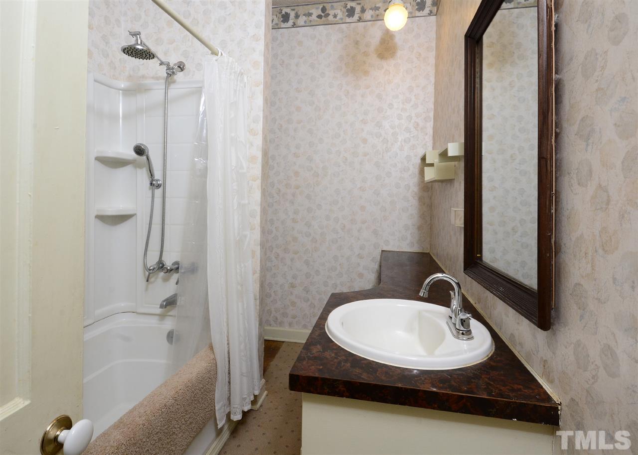 2114 Bahama Road Bahama, NC 27503 - Photo 9 of 21 a bathroom with a sink and a mirror