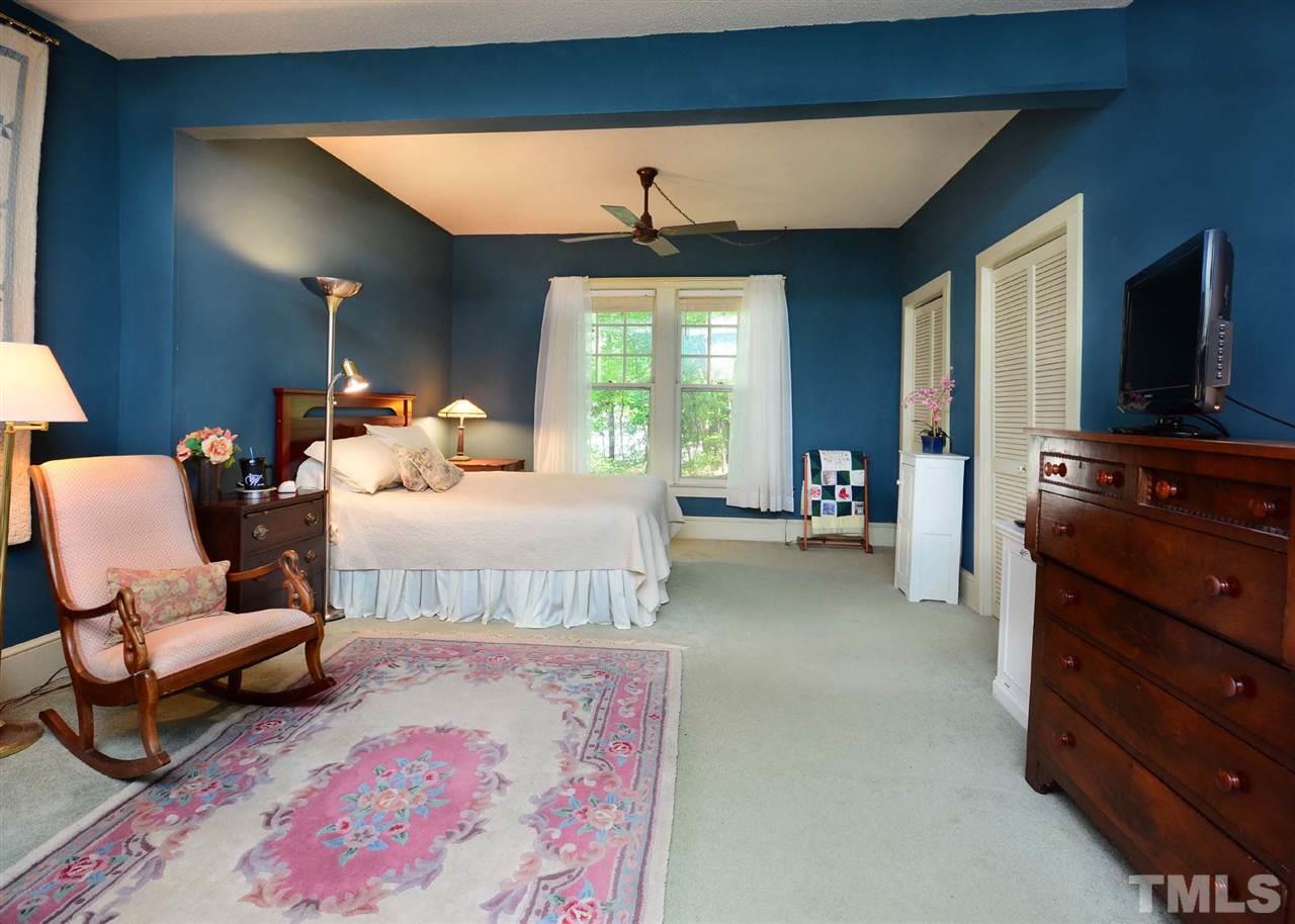 2114 Bahama Road Bahama, NC 27503 - Photo 10 of 21 a bedroom with furniture and a flat screen tv