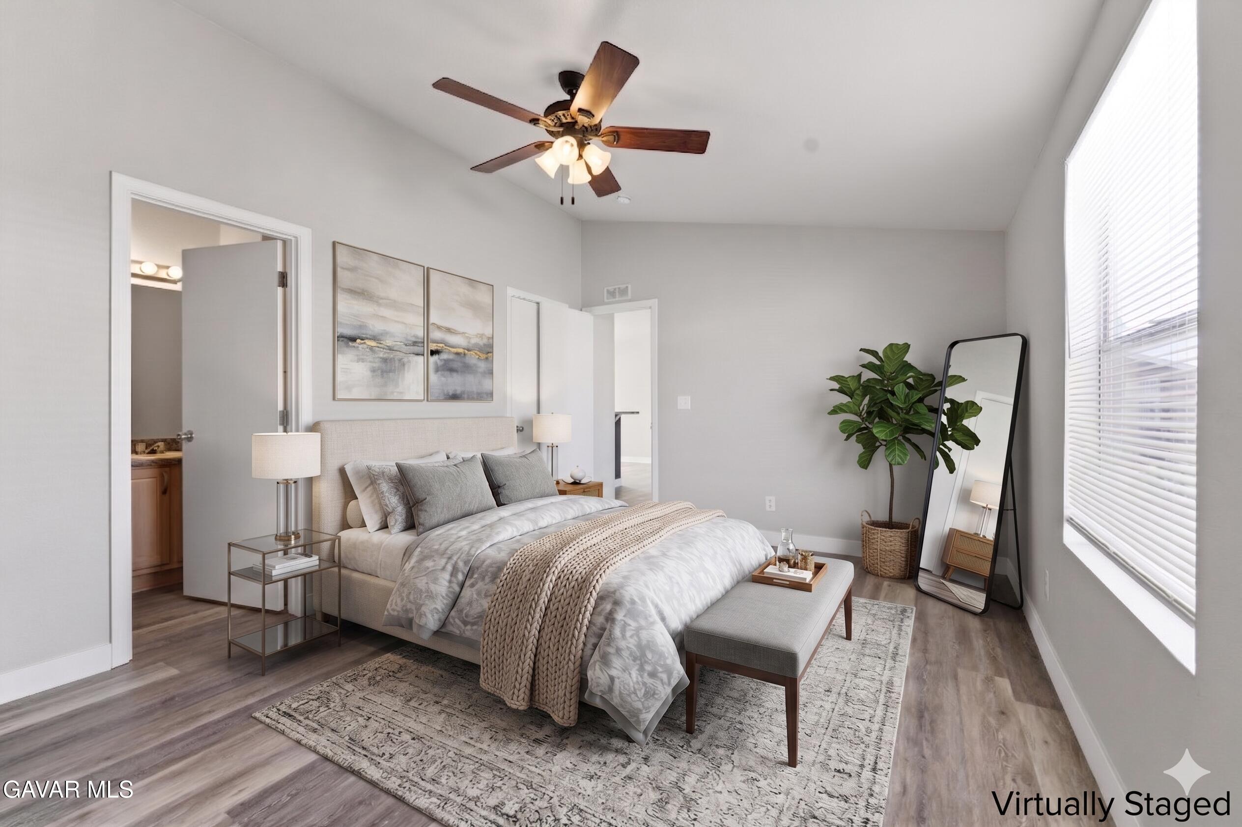 20843 Waalew Road Apple Valley, CA 92307 - Photo 13 of 40 a bedroom with a bed and a window