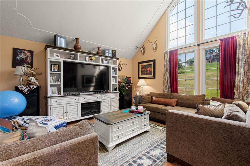 3054 Bedillion Road Washington, PA 15301 - Photo 2 of 47 Soaring vaulted ceilings and a wall of windows fill the family room with natural light.