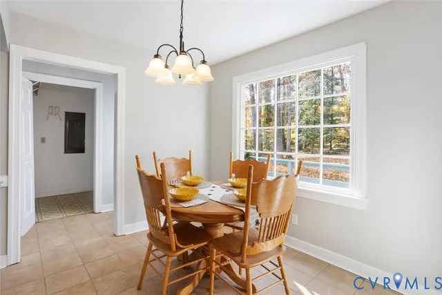 a dining room with furniture and window