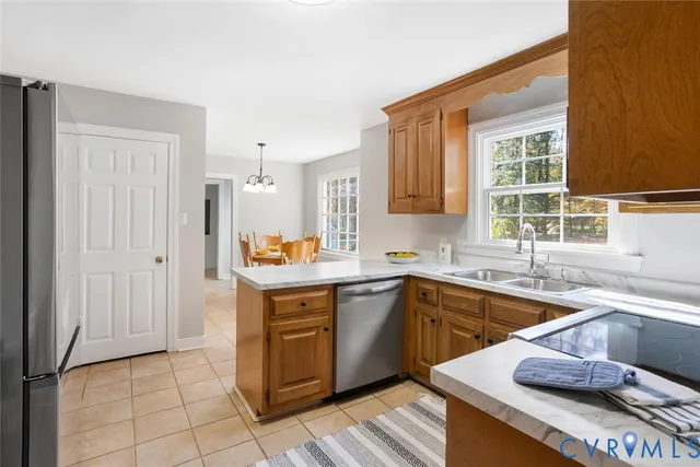 a kitchen with a sink stove and window