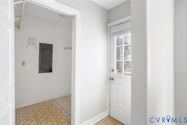 a view of hallway with wooden floor