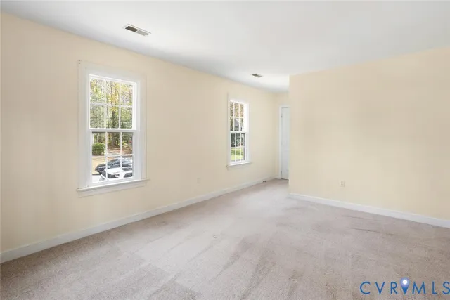 an empty room with windows