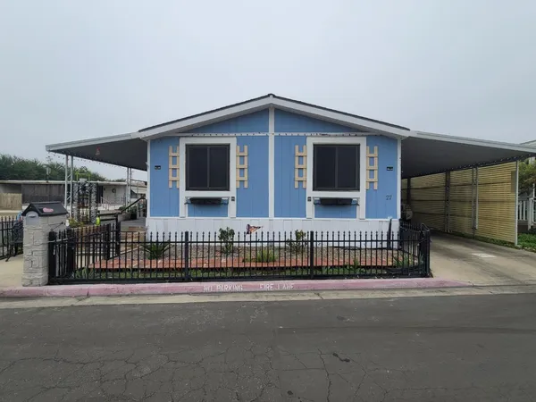 a view of a house with a street