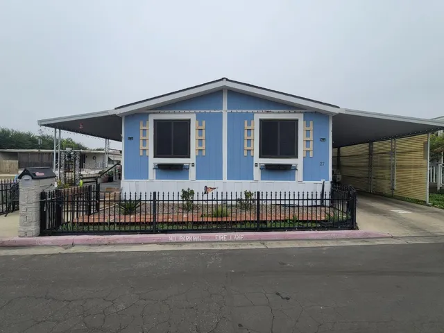 a view of a house with a street