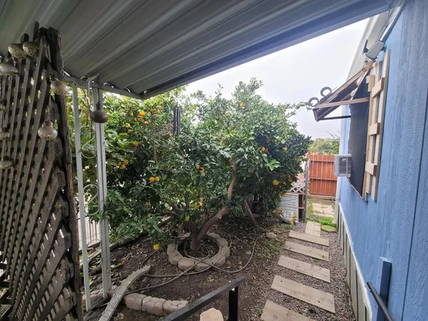 a backyard of a house with lots of green space