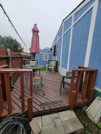 a view of a balcony with chairs