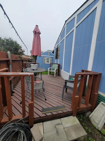 a view of a balcony with chairs