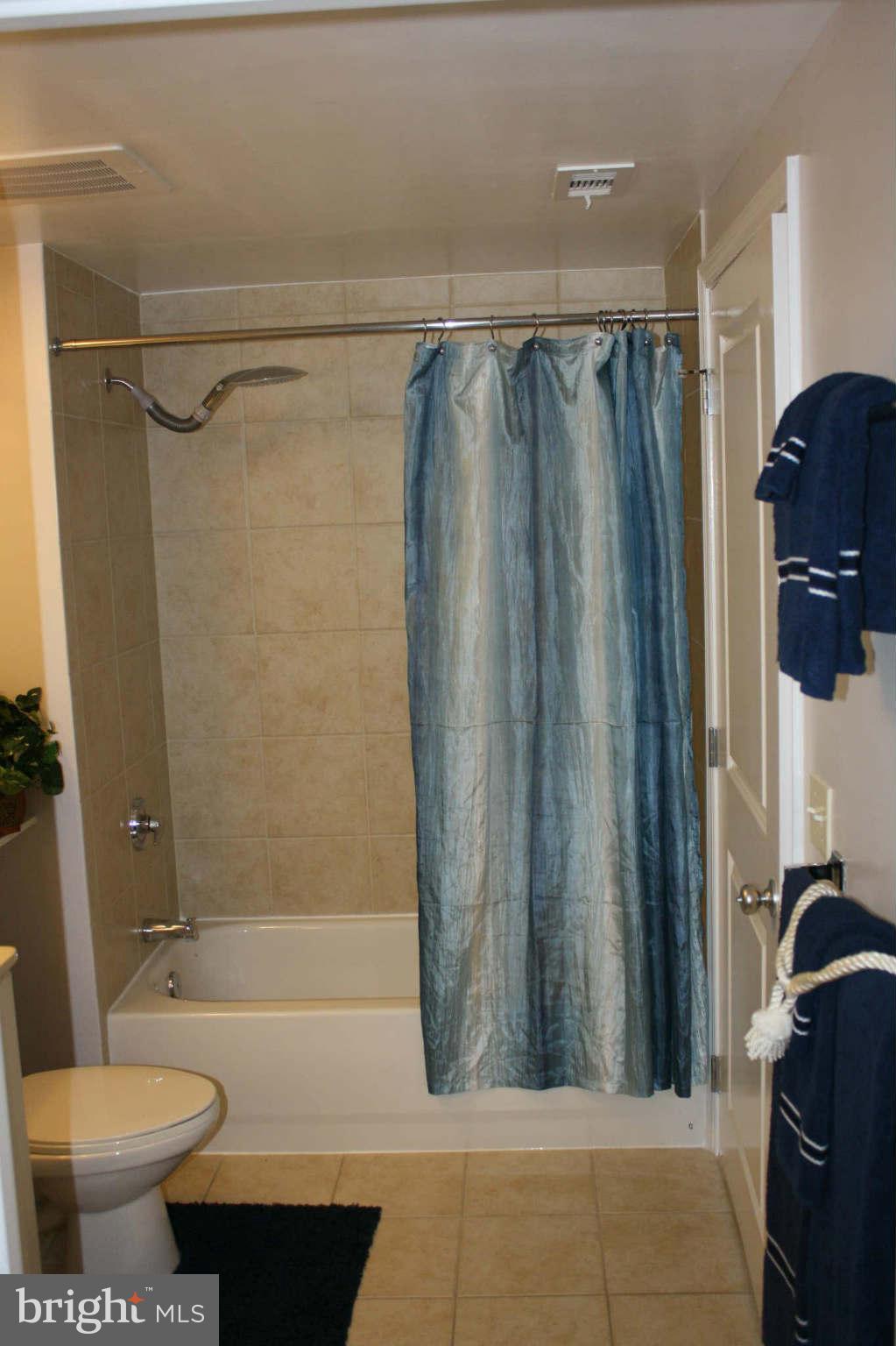 851 North Glebe Road, Unit 912 Arlington, VA 22203 - Photo 11 of 21 a bathroom with a shower and a toilet
