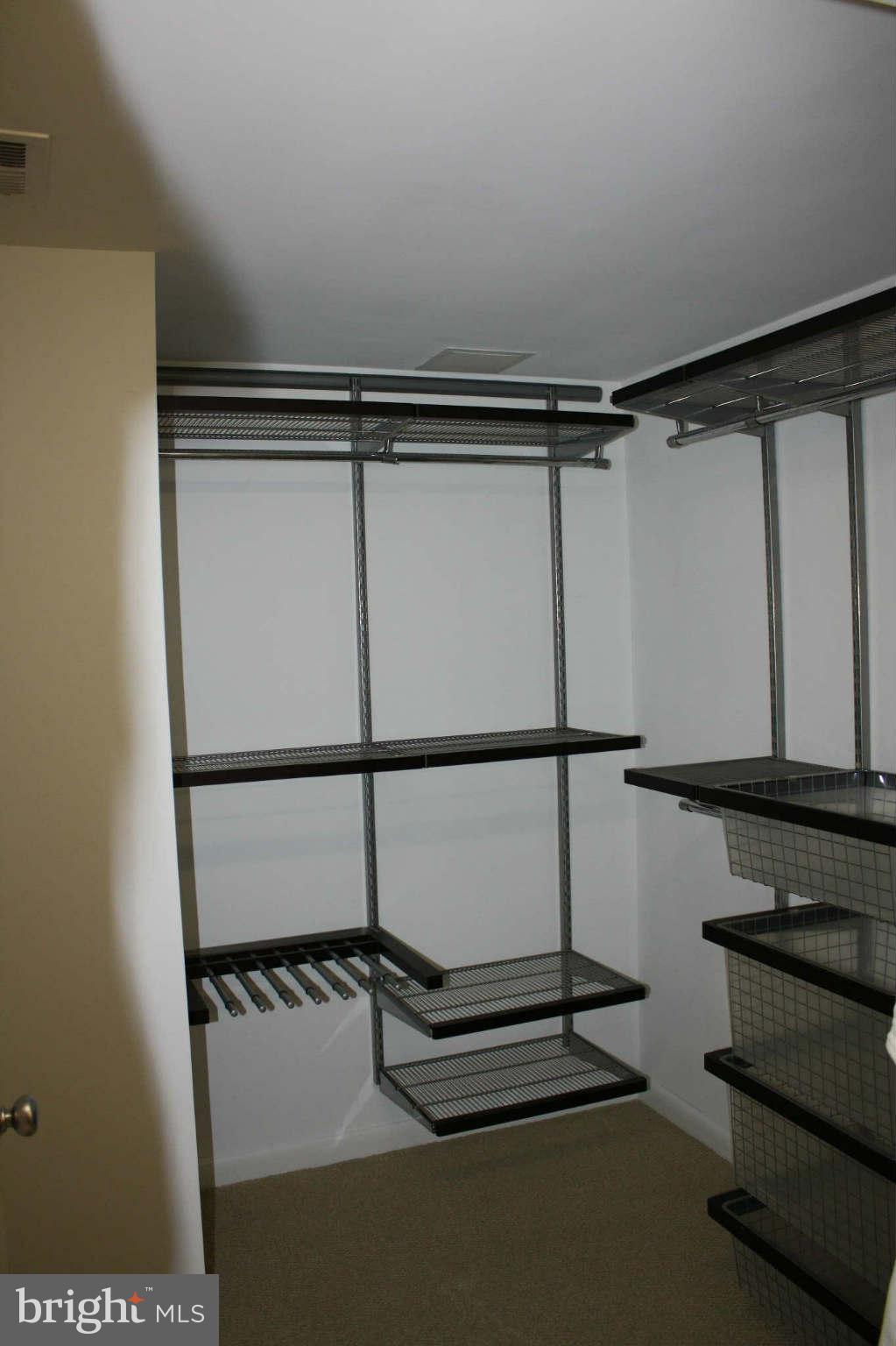 851 North Glebe Road, Unit 912 Arlington, VA 22203 - Photo 12 of 21 a view of a room with racks on the wall
