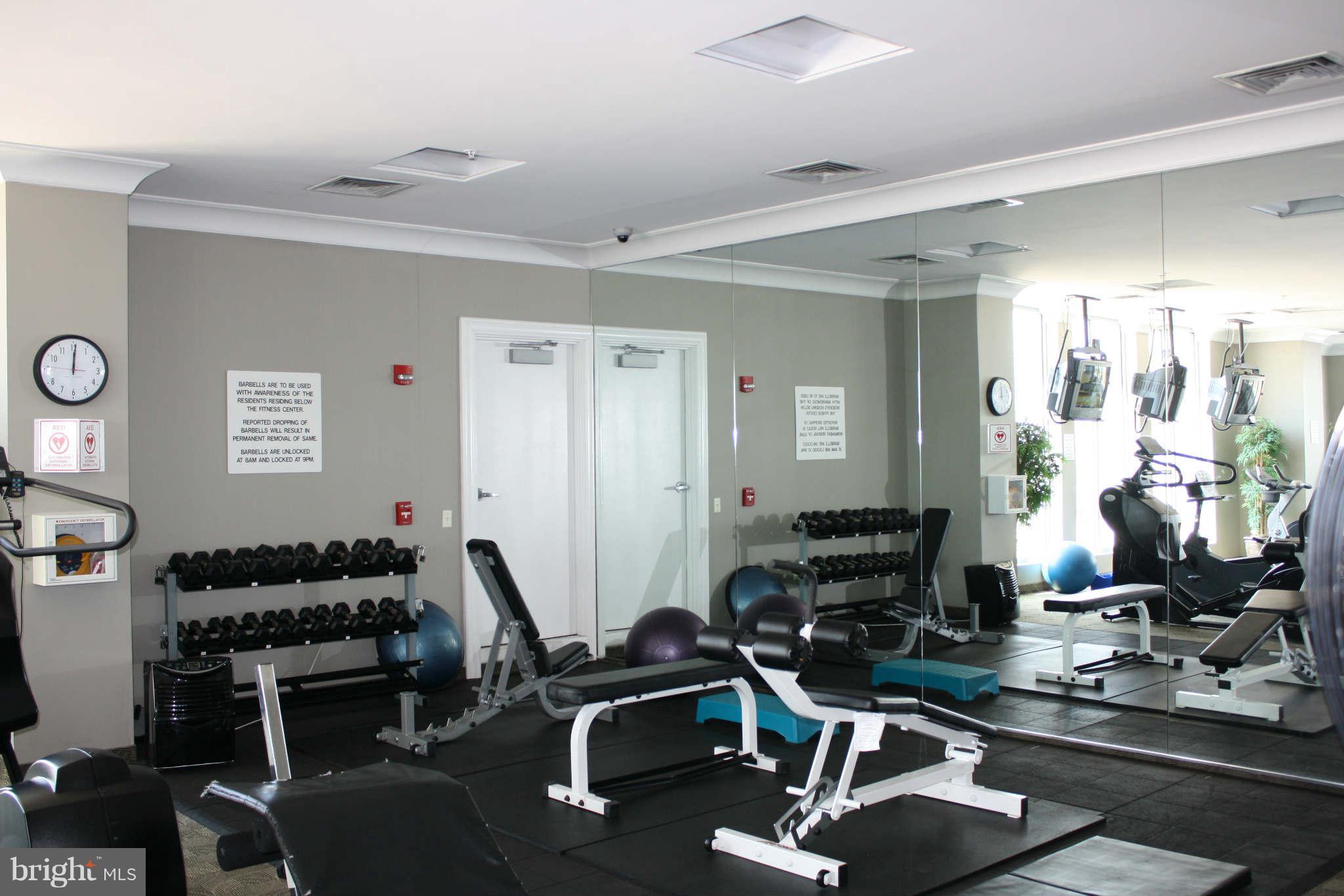 851 North Glebe Road, Unit 912 Arlington, VA 22203 - Photo 15 of 21 a room with gym equipment and view of living room