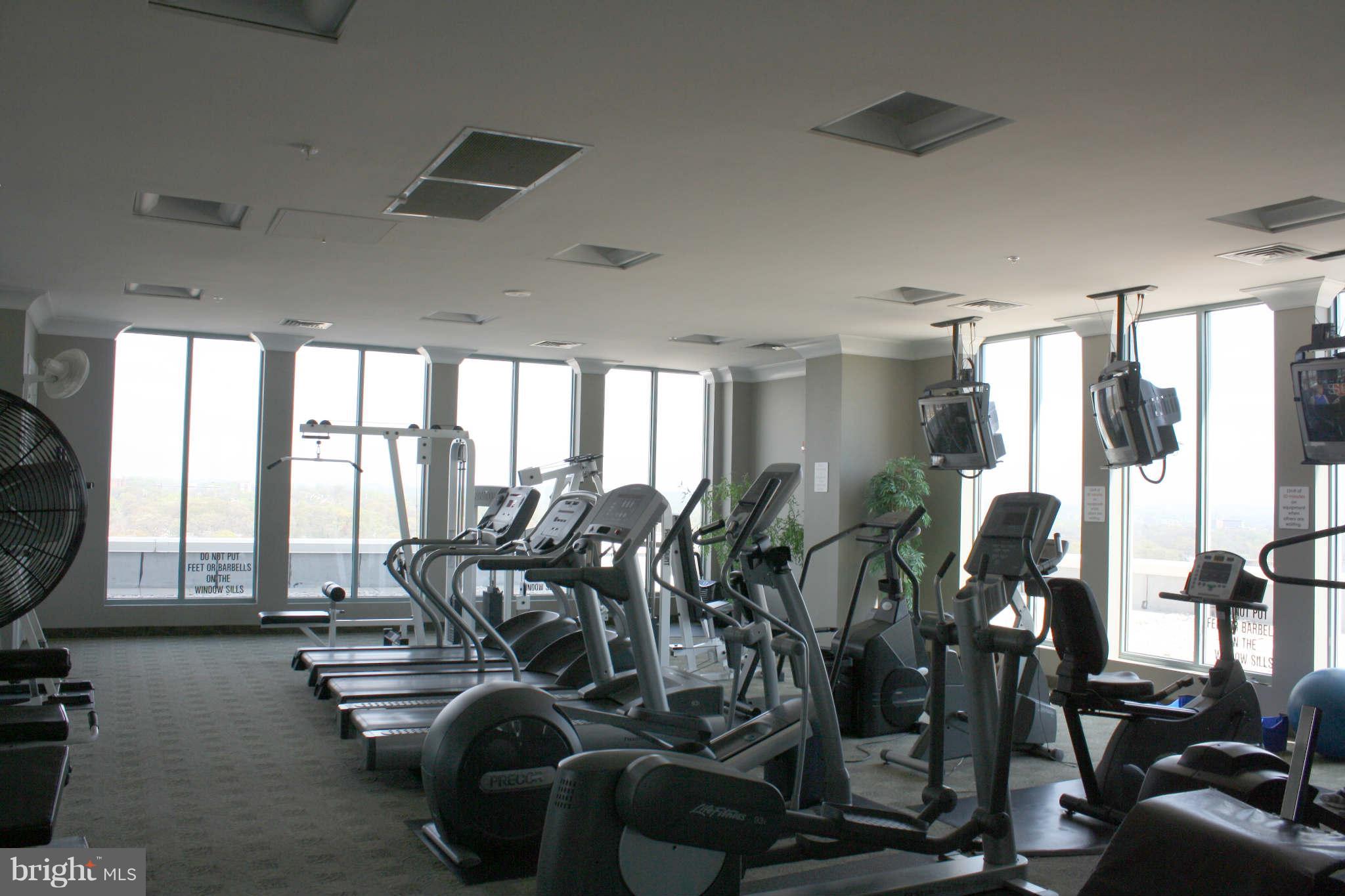 851 North Glebe Road, Unit 912 Arlington, VA 22203 - Photo 16 of 21 a gym room with lots of gym equipment