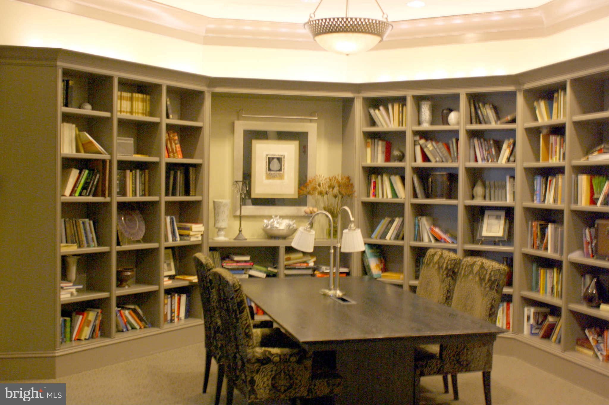 851 North Glebe Road, Unit 912 Arlington, VA 22203 - Photo 17 of 21 a view of a dining room with furniture and a book shelf