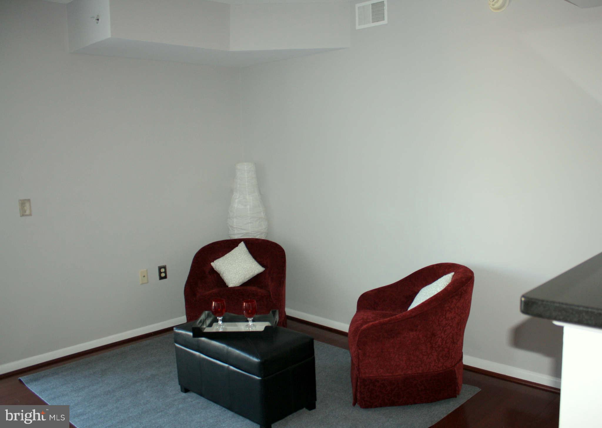 851 North Glebe Road, Unit 912 Arlington, VA 22203 - Photo 8 of 21 a living room with furniture