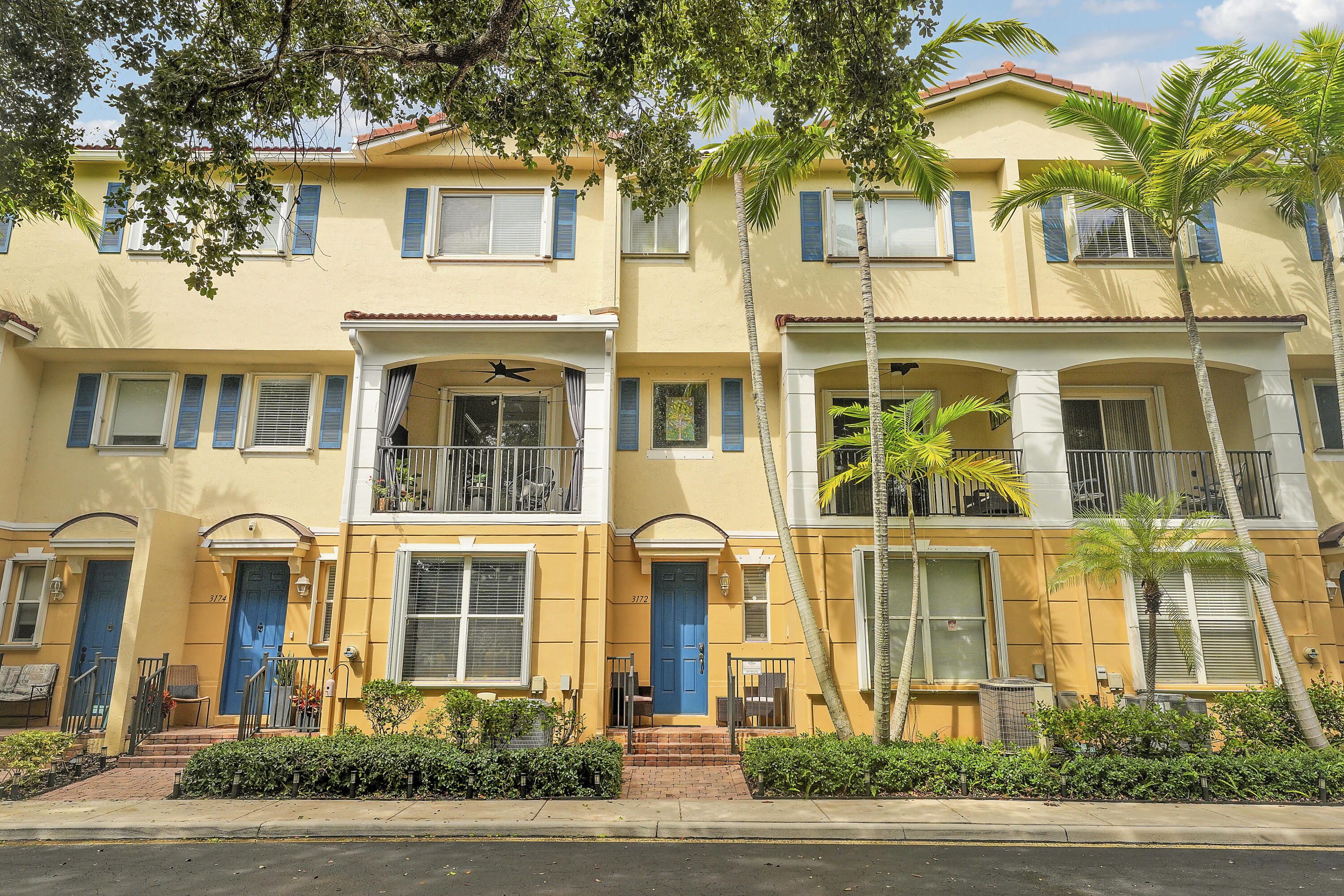 a couple of potted plants in front of a house